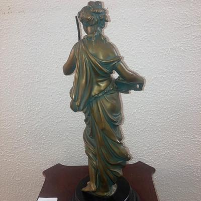 Patinated metal sculpture of a woman