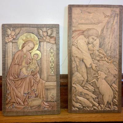 Pair of religious motif carved wood wall plaques
