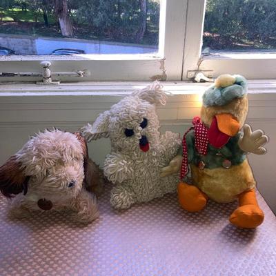 Lot of vintage dolls and stuffed animals