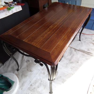 WROUGHT IRON TABLE WITH WOOD TOP.