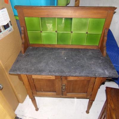 WASHSTAND WITH MARBLE TOP AND TILE BACK BOARD.