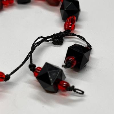 ORANGE, BLACK STRING BRACELET GLASS BEADS