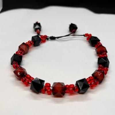 ORANGE, BLACK STRING BRACELET GLASS BEADS