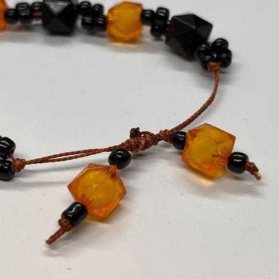 STRING TIE BRACELET BLACK & AMBER BEADS