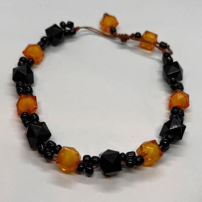 STRING TIE BRACELET BLACK & AMBER BEADS