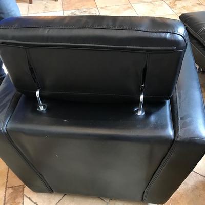 Black Swivel chair with movable head rest