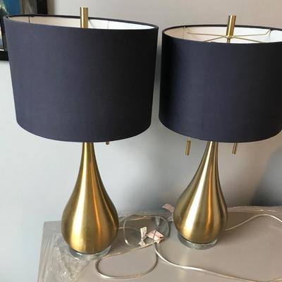 Pair of brass colored teardrop table lamps