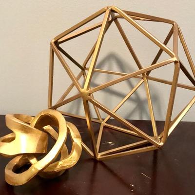 Gold colored geometric sculptures
