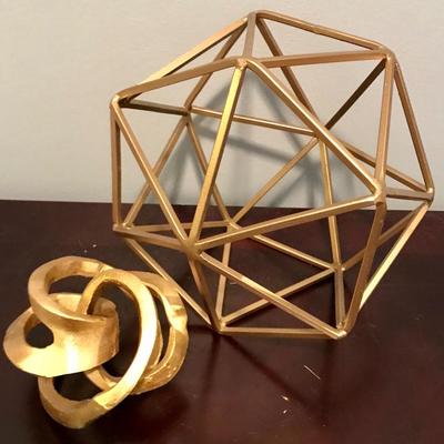 Gold colored geometric sculptures