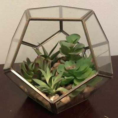 Glass terrarium with fake plants