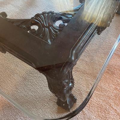 Beveled square heavy glass coffee table with carved wooden base
