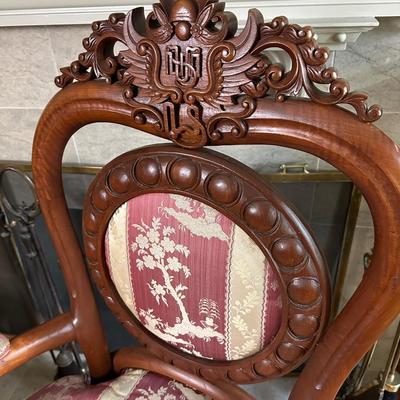 LOT 11. PAIR OF ORNATELY CARVED RED TEAK ARM CHAIRS