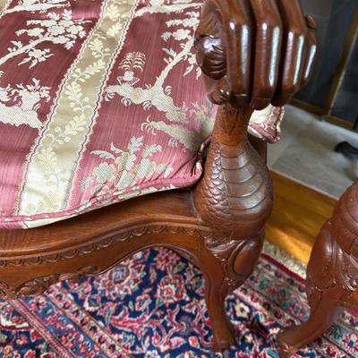 LOT 11. PAIR OF ORNATELY CARVED RED TEAK ARM CHAIRS