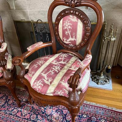 LOT 11. PAIR OF ORNATELY CARVED RED TEAK ARM CHAIRS