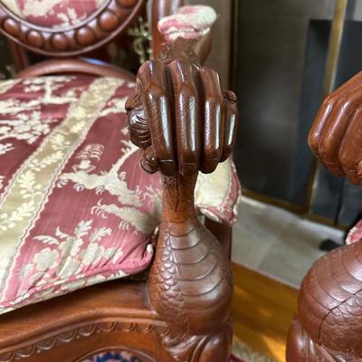 LOT 11. PAIR OF ORNATELY CARVED RED TEAK ARM CHAIRS
