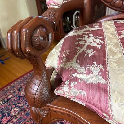 LOT 11. PAIR OF ORNATELY CARVED RED TEAK ARM CHAIRS