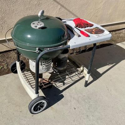 Green Weber Kettle BBQ with Wheeled Cart