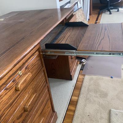 Large wood desk with a Burl wood vase