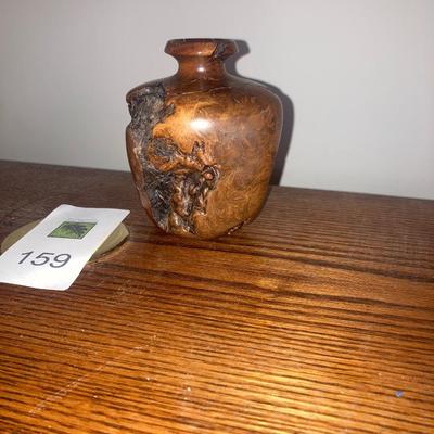 Large wood desk with a Burl wood vase