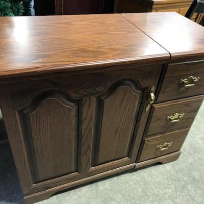 Sewing machine cabinet