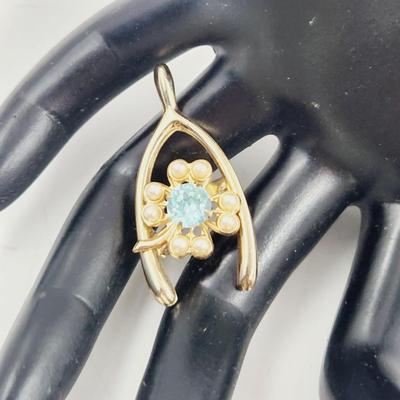 VINTAGE GOLD TONED BLUE CRYSTAL WISH BONE PIN