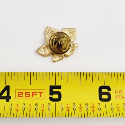 VINTAGE GOLD TONED LILLY W/ PURPLE CRYSTAL PIN