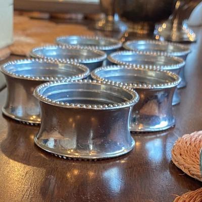 9 silver plate napkin rings 