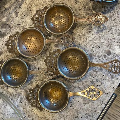 6 Silverplate tea strainers