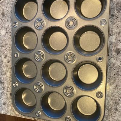Assorted Baking Items; 2 Loaf Pans; 3 Muffin Pans: 1 (7") stainless steel fluted brioche pan; 3 Wire Cooling racks