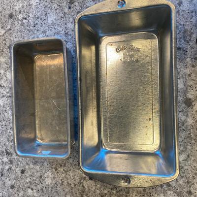 Assorted Baking Items; 2 Loaf Pans; 3 Muffin Pans: 1 (7") stainless steel fluted brioche pan; 3 Wire Cooling racks