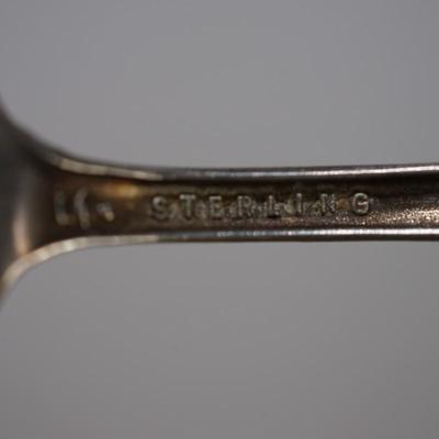 Early 1900's STERLING SOUVENIR SPOON WITH NATIVE AMERICAN FIGURE HOLDING SHIELD. 