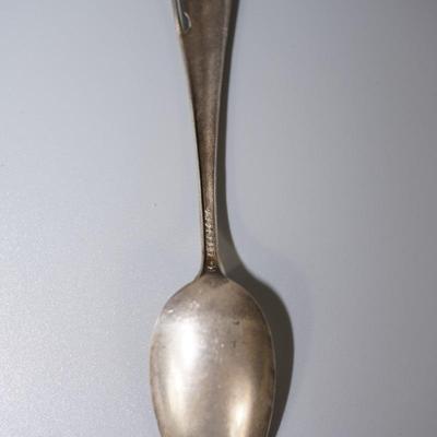 Early 1900's STERLING SOUVENIR SPOON WITH NATIVE AMERICAN FIGURE HOLDING SHIELD. 