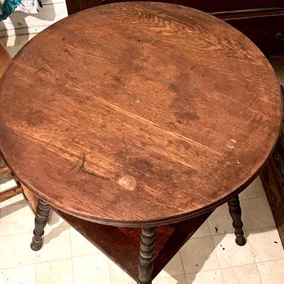 Round top spool leg table