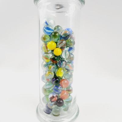 GLASS FULL OF MARBLES