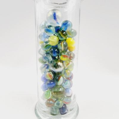 GLASS FULL OF MARBLES