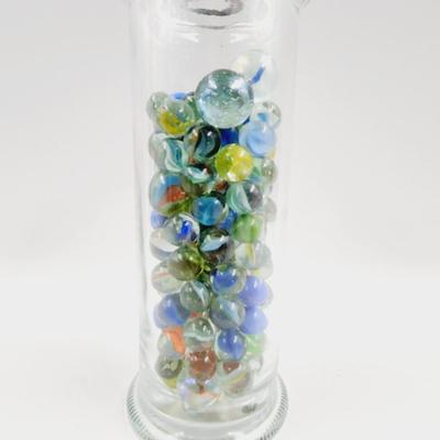 GLASS FULL OF MARBLES