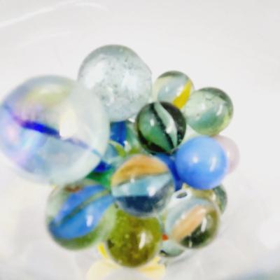 GLASS FULL OF MARBLES