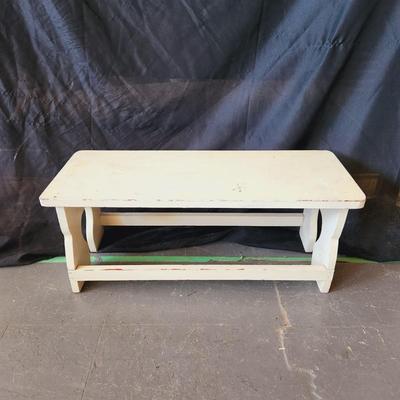 CREAM COLORED WOODEN BENCH