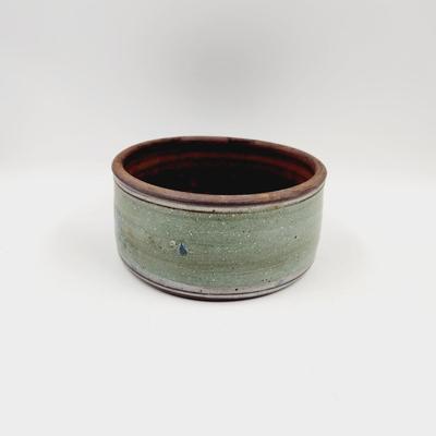TEAL & BROWN STAMPED POTTERY BOWL
