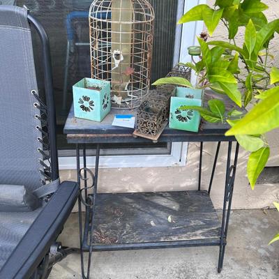 outdoor metal side table with rustic items