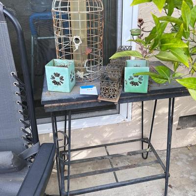 outdoor metal side table with rustic items