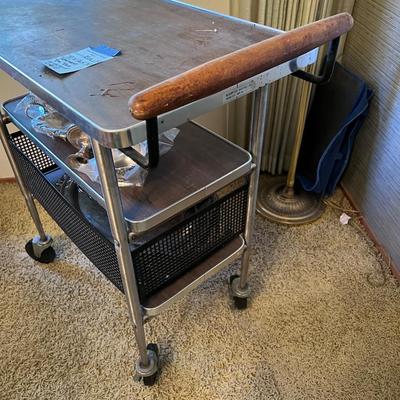 Metal and Laminate trolley on black casters with extension shelf