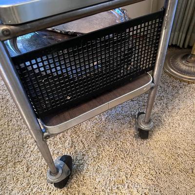 Metal and Laminate trolley on black casters with extension shelf