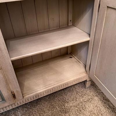 Mid Century blond sideboard with decorative cabinet fronts