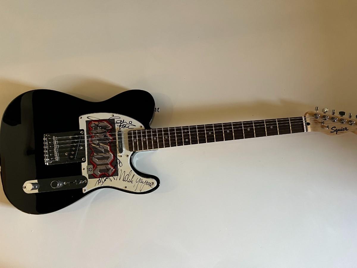 AC/DC band signed guitar | EstateSales.org