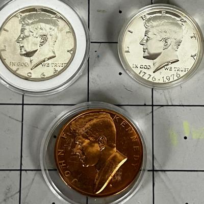 2 Kennedy Half Dollars and A Commemorative Copper Kennedy Coin 