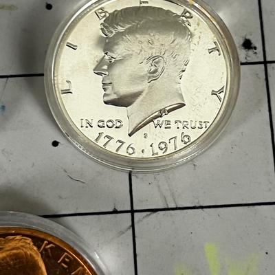 2 Kennedy Half Dollars and A Commemorative Copper Kennedy Coin 