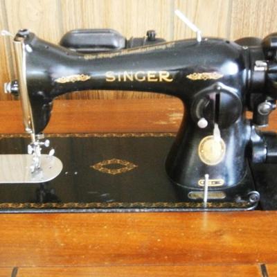 Singer Electric Sewing Machine in wood cabinet
