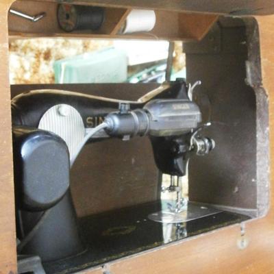 Singer Electric Sewing Machine in wood cabinet