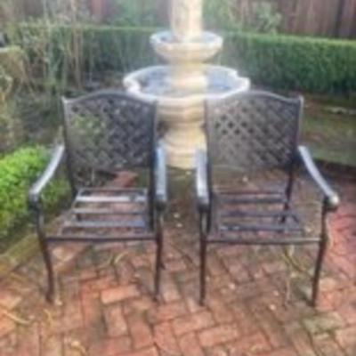 Pair of metal patio chairs with table